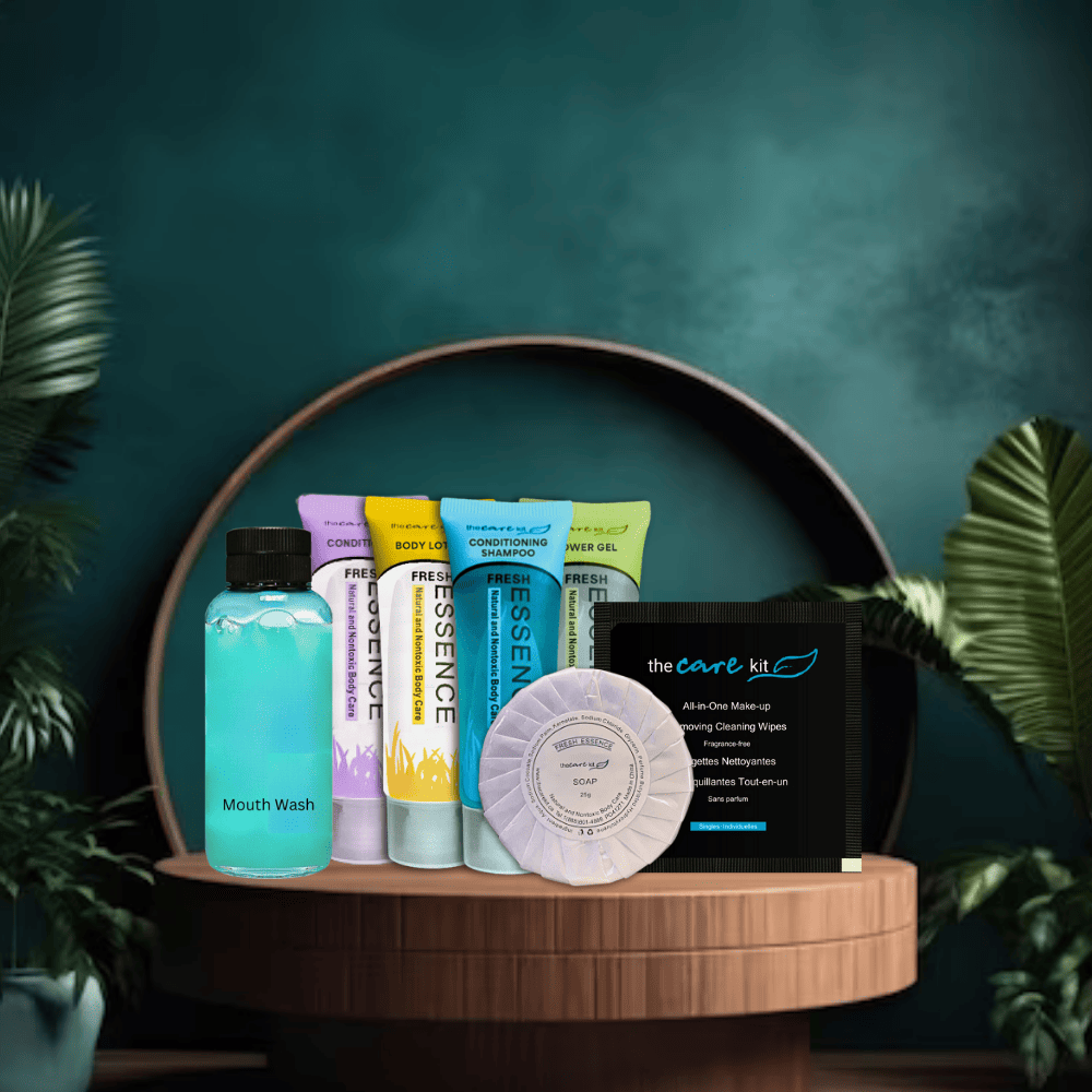 The Care Kit – 7-Pc Travel Pack: shampoo, conditioner, lotion, shower gel, mouthwash, makeup remover, and soap.background.