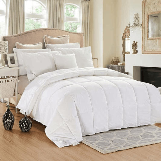 Mulberry silk duvet Cozy white bedding on bed.